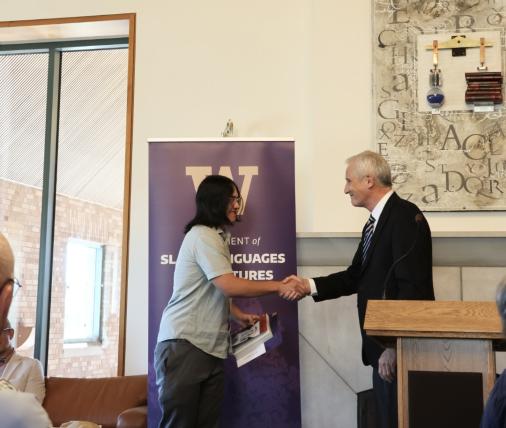Maddox Unočić receiving his award certification.