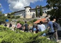 students walking through the medieval hill town of Štanjel, Slovenia