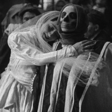 Veiled woman hugging death